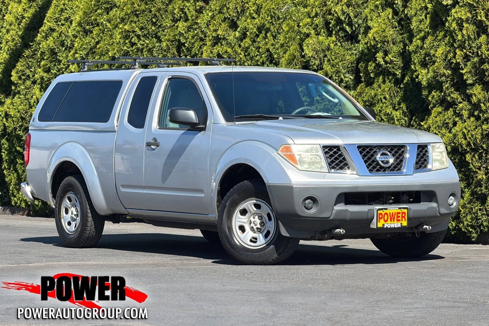 2006 Nissan Frontier XE in Silver — front three-quarter view