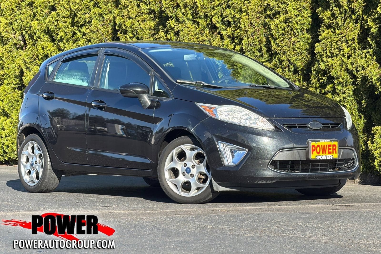 2011 Ford Fiesta SES in Black — front three-quarter view