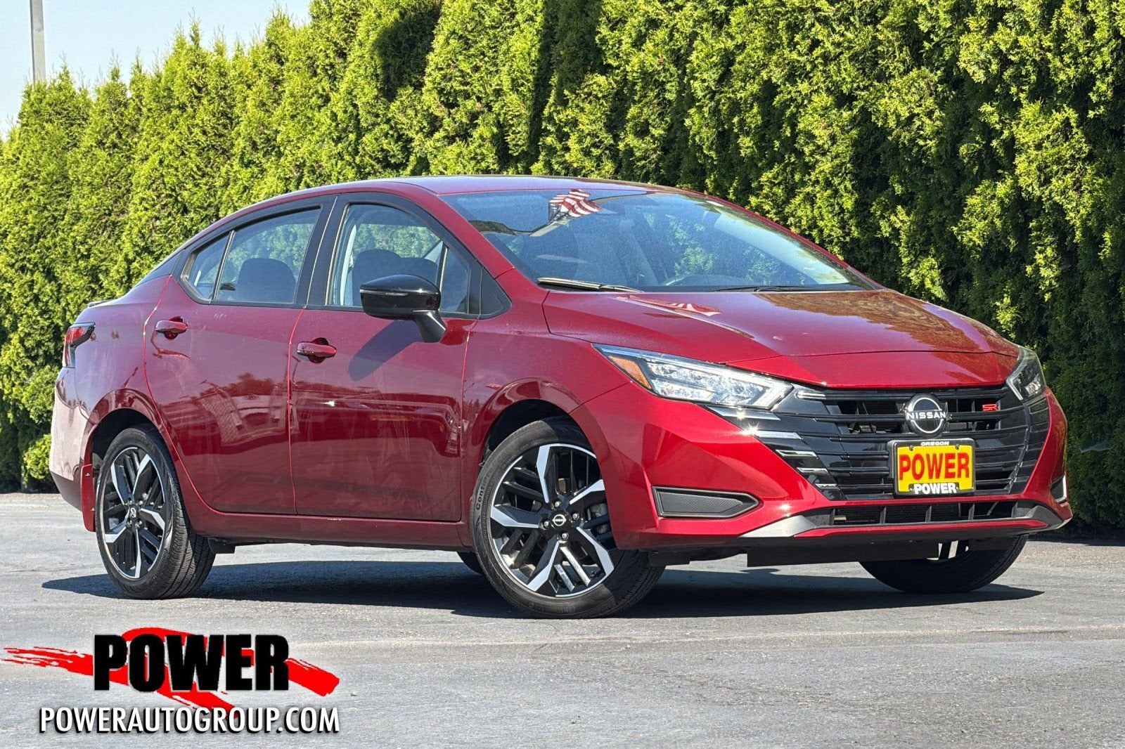 2024 Nissan Versa SR in Scarlet Ember T — front three-quarter view