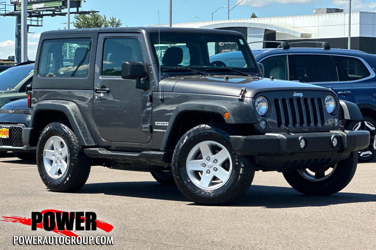 2018 Jeep Wrangler JK Freedom Edition in Gray — front three-quarter view
