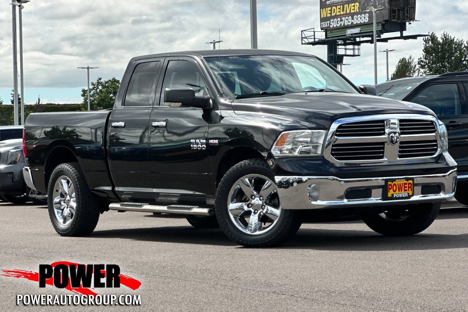 2016 RAM 1500 Big Horn in Brilliant Black C — front three-quarter view