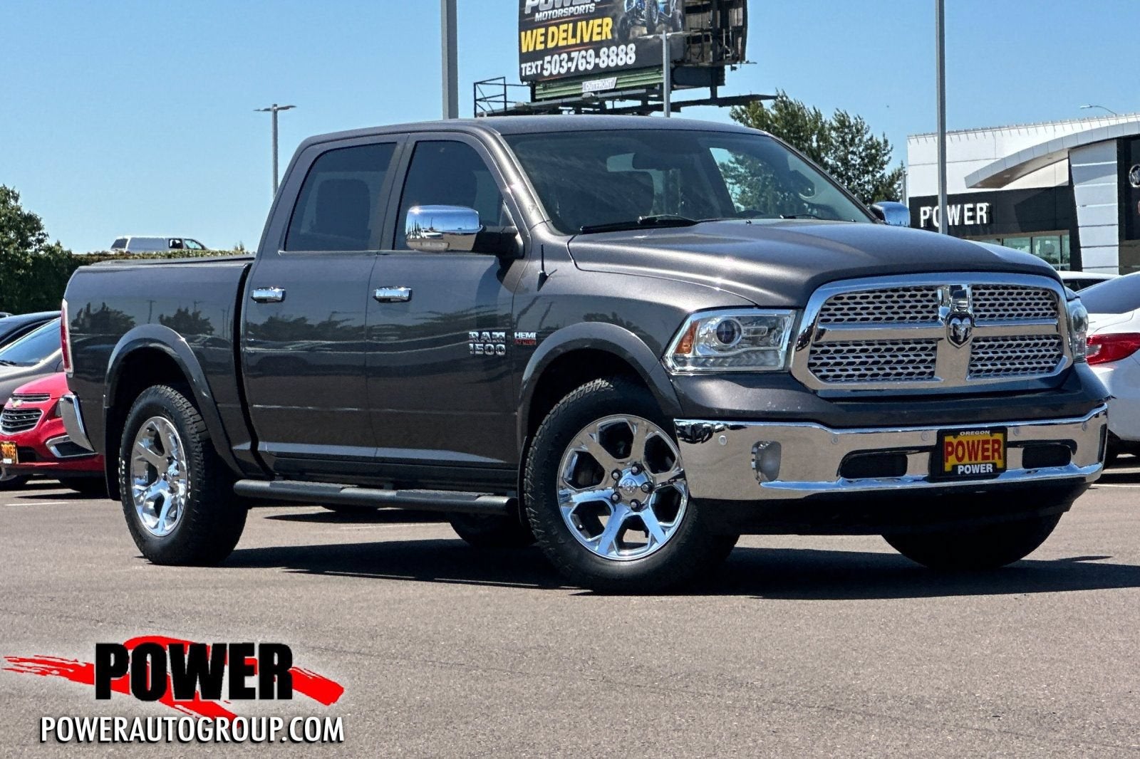 2016 RAM 1500 Laramie in Granite Crystal M — front three-quarter view