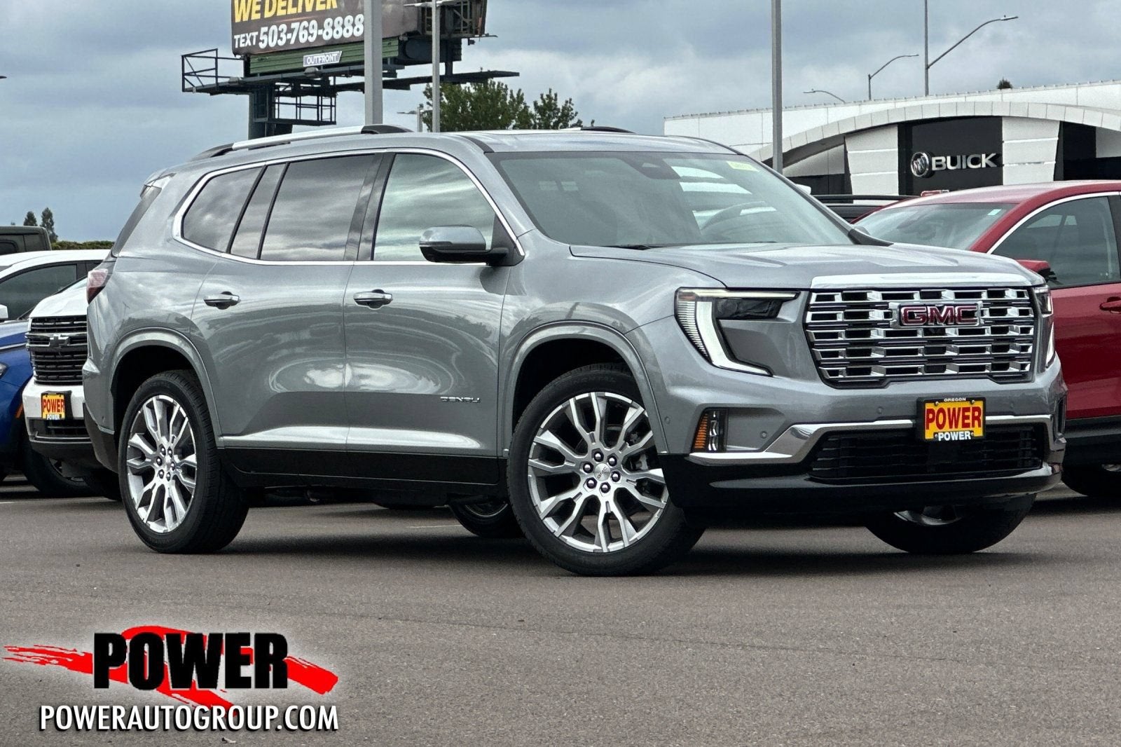 2026 GMC Acadia Denali in Sterling Metallic — front three-quarter view