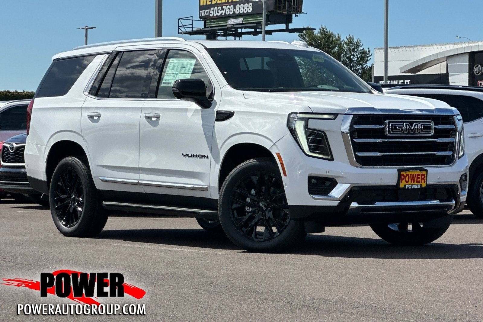 2026 GMC Yukon Elevation in Summit White — front three-quarter view