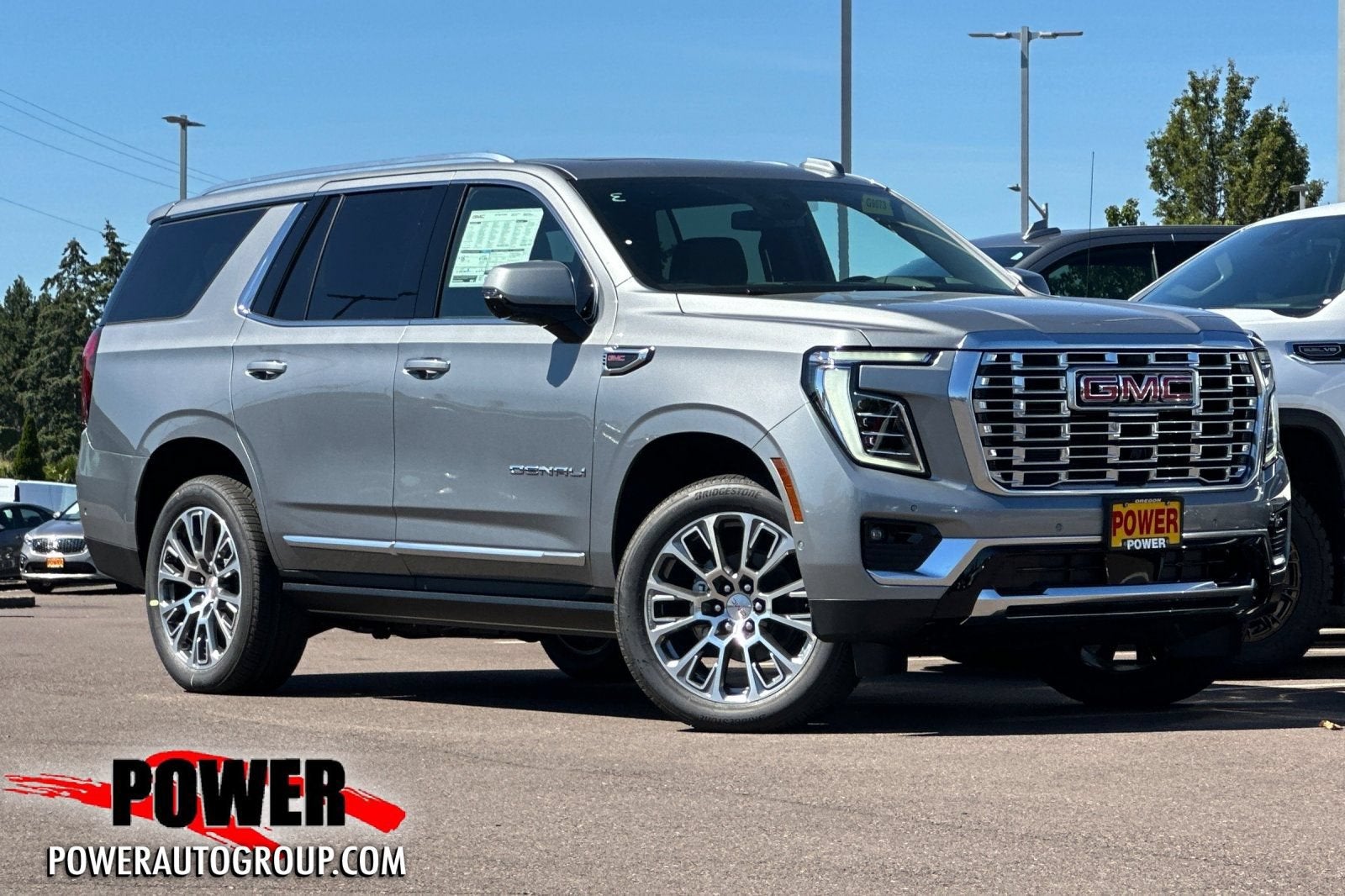 2026 GMC Yukon Denali in Sterling Metallic — front three-quarter view