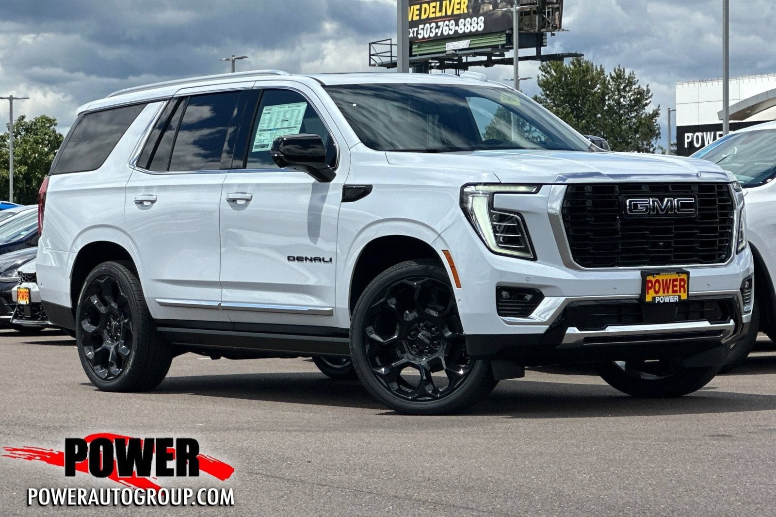 2026 GMC Yukon Denali in Glacier White Tricoat — front three-quarter view