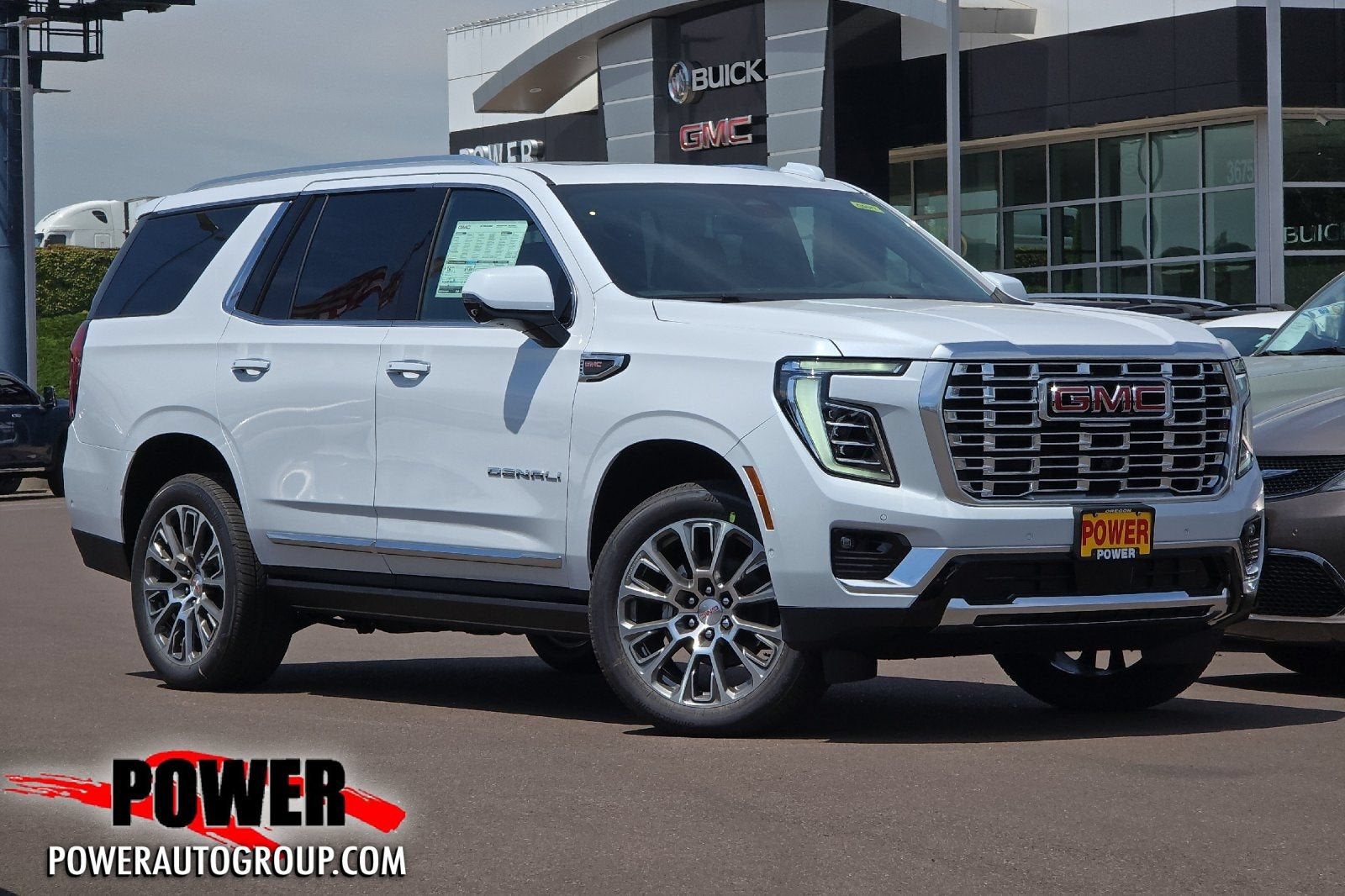 2026 GMC Yukon Denali in Glacier White Tricoat — front three-quarter view