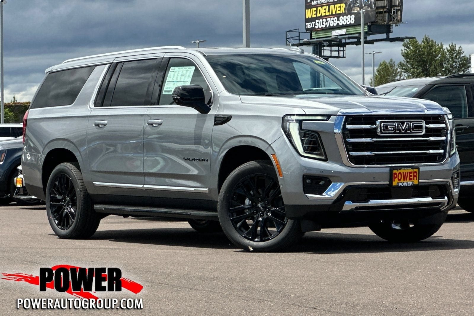2026 GMC Yukon XL Elevation in Sterling Metallic — front three-quarter view
