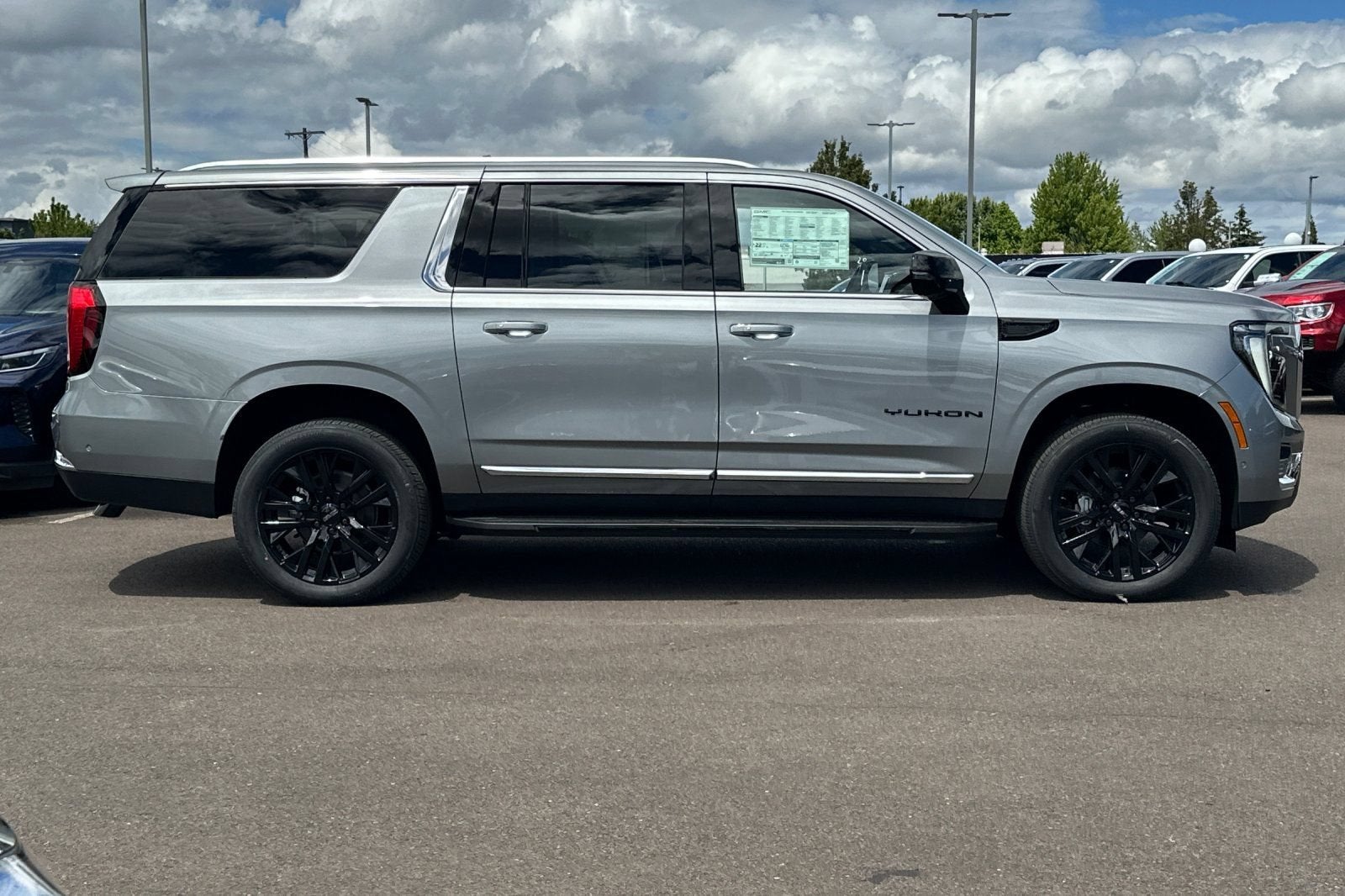 2026 GMC Yukon XL — rear three-quarter view
