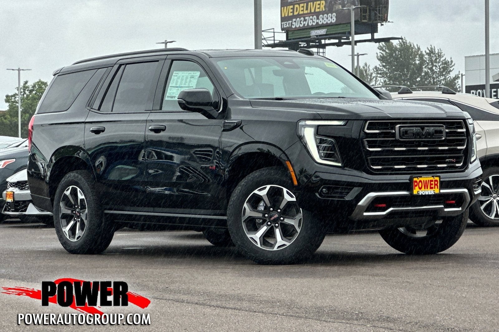 2026 GMC Yukon AT4 Ultimate in Onyx Black — front three-quarter view