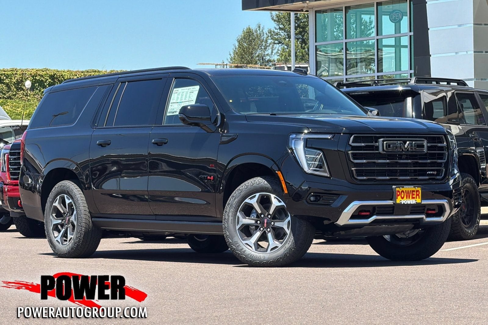 2026 GMC Yukon XL AT4 Ultimate in Onyx Black — front three-quarter view
