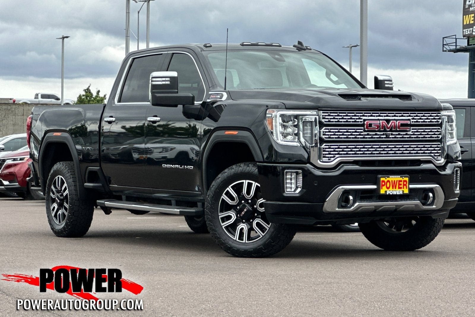 2021 GMC Sierra 2500 HD Denali in Ebony Twilight Metallic — front three-quarter view