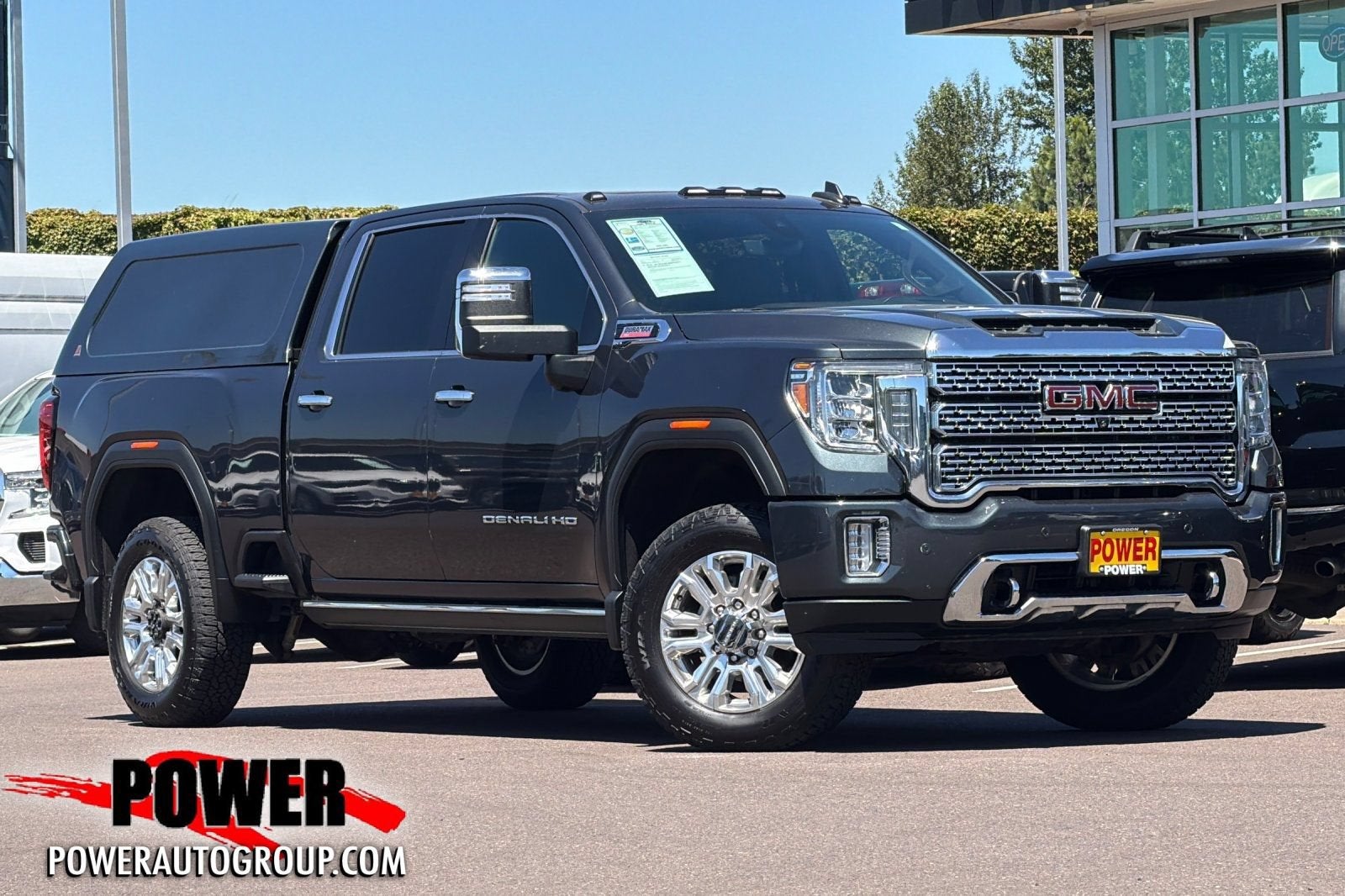 2021 GMC Sierra 2500 HD Denali in Hunter Metallic — front three-quarter view