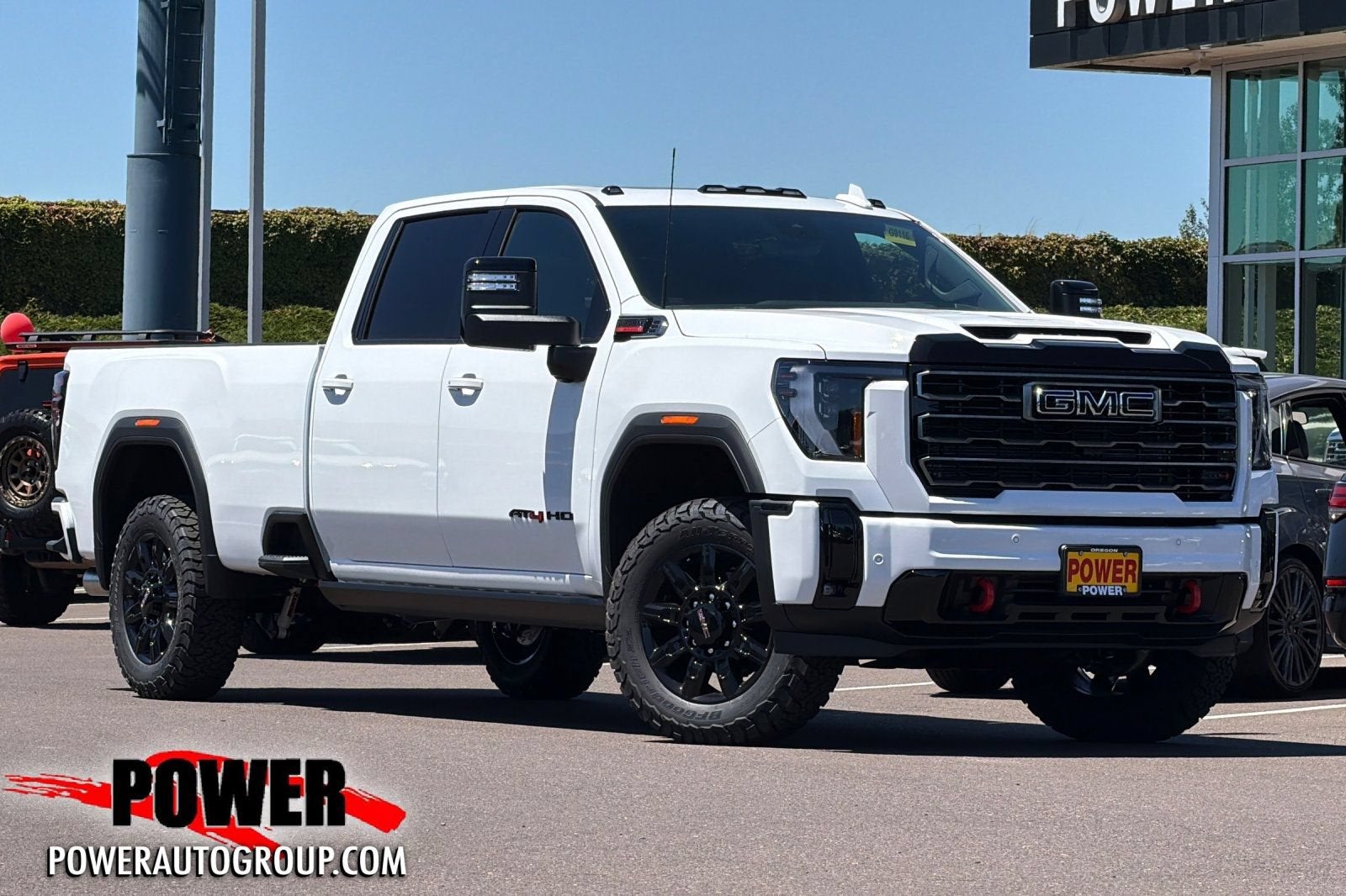 2026 GMC Sierra 2500 HD AT4 in Summit White — front three-quarter view