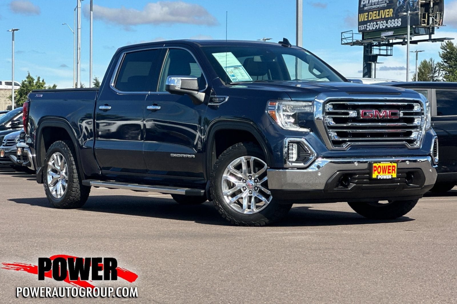 2020 GMC Sierra 1500 SLT in Pacific Blue Metallic — front three-quarter view