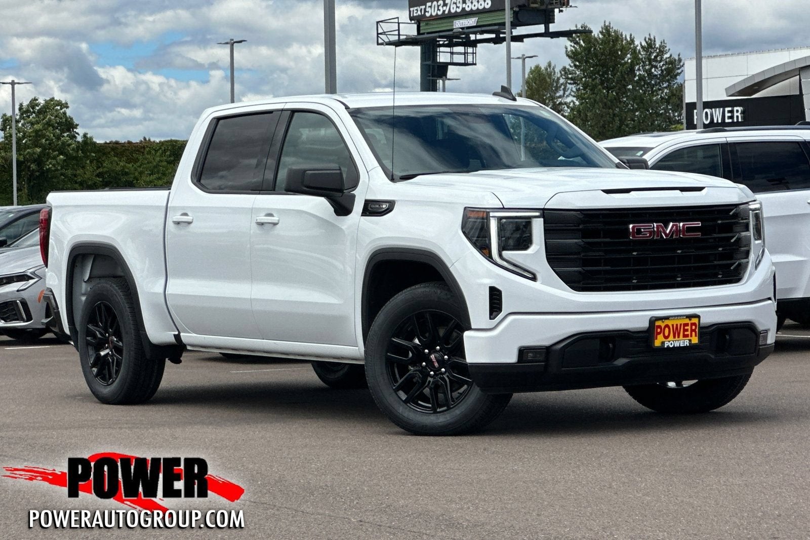 2023 GMC Sierra 1500 Elevation in Summit White — front three-quarter view