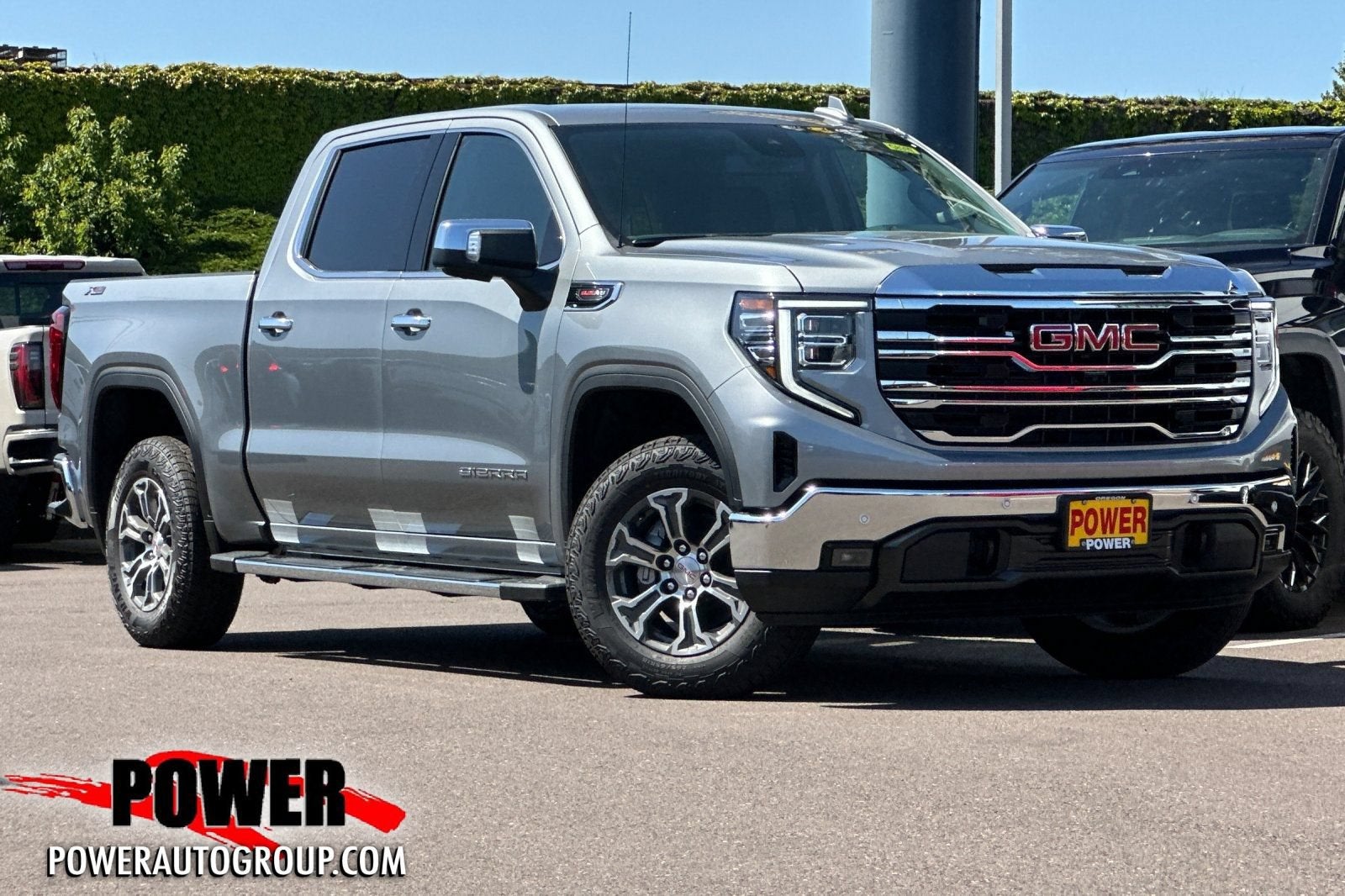 2026 GMC Sierra 1500 SLT in Sterling Metallic — front three-quarter view