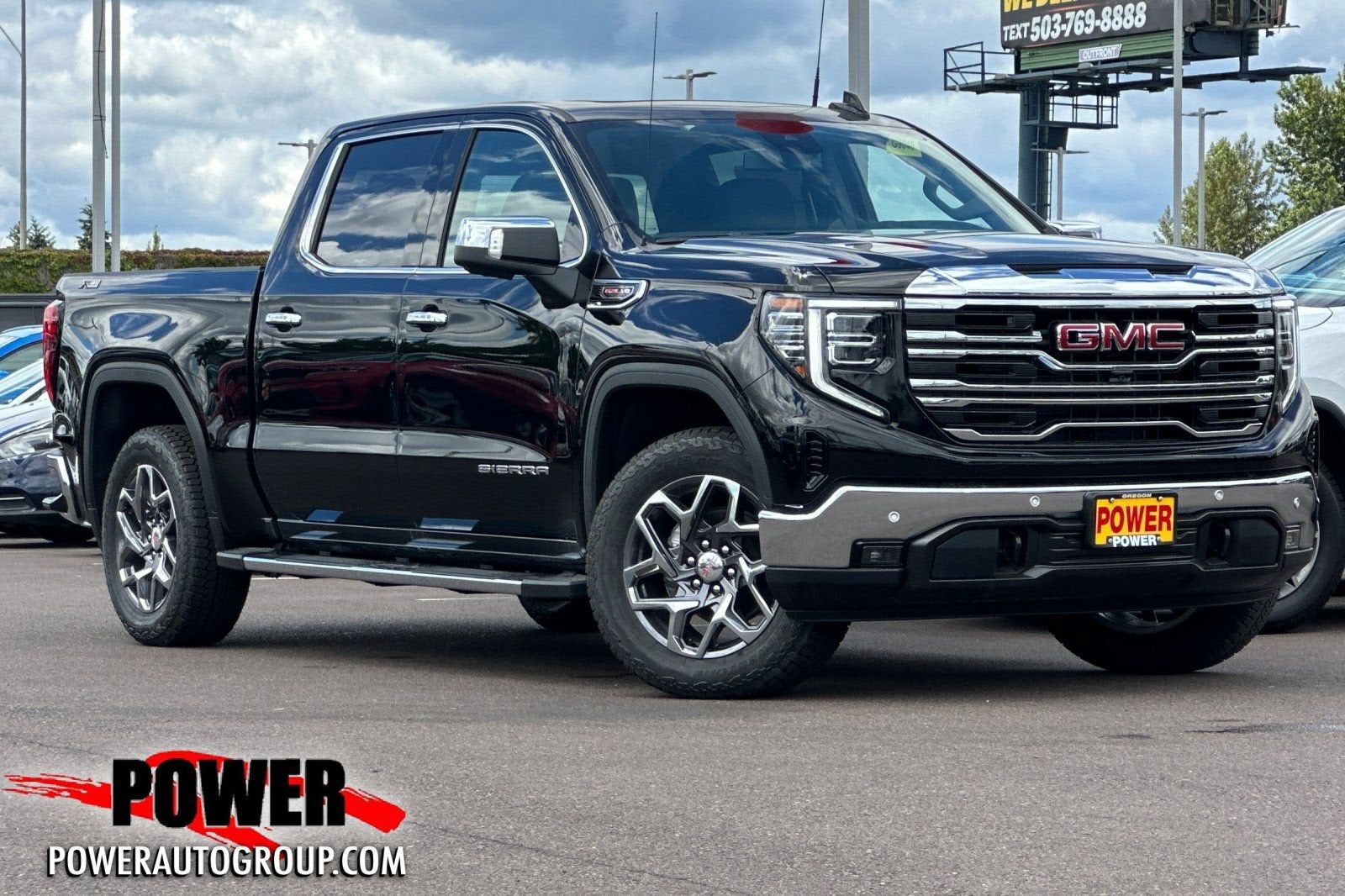 2026 GMC Sierra 1500 SLT in Onyx Black — front three-quarter view