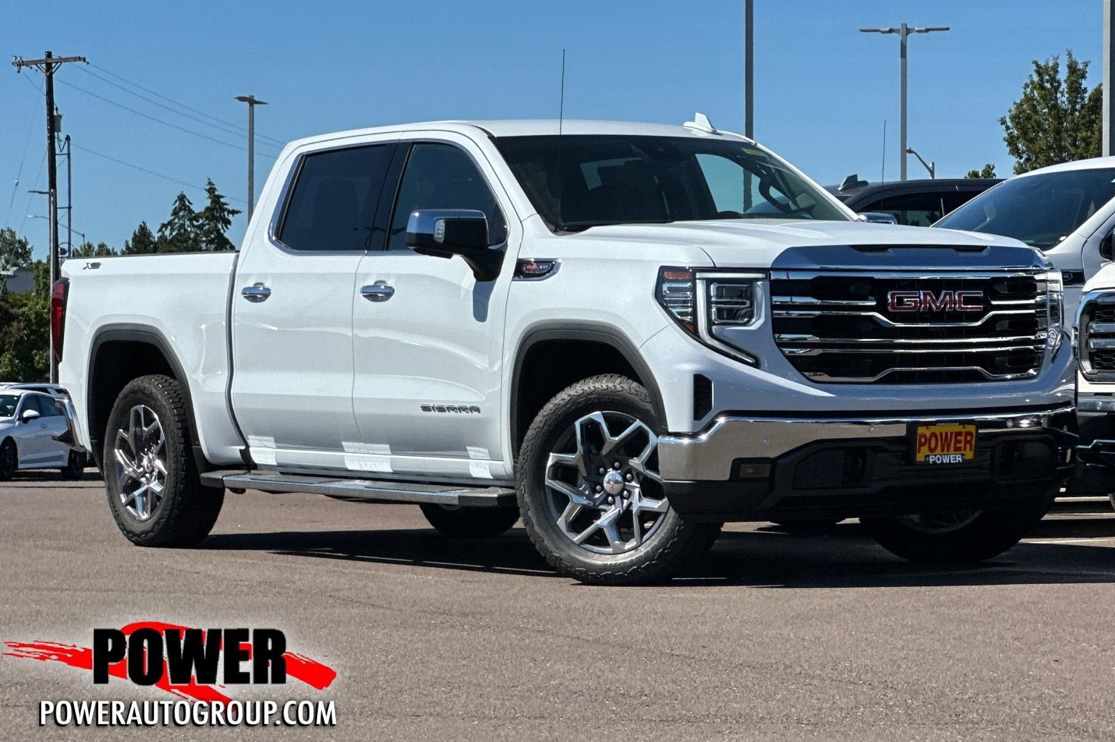 2026 GMC Sierra 1500 SLT in Glacier White Tricoat — front three-quarter view