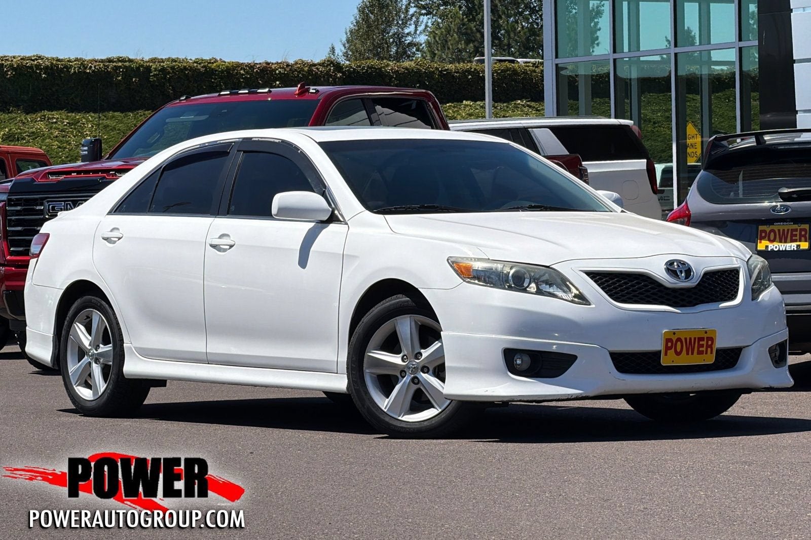 2011 Toyota Camry LE in Super White — front three-quarter view