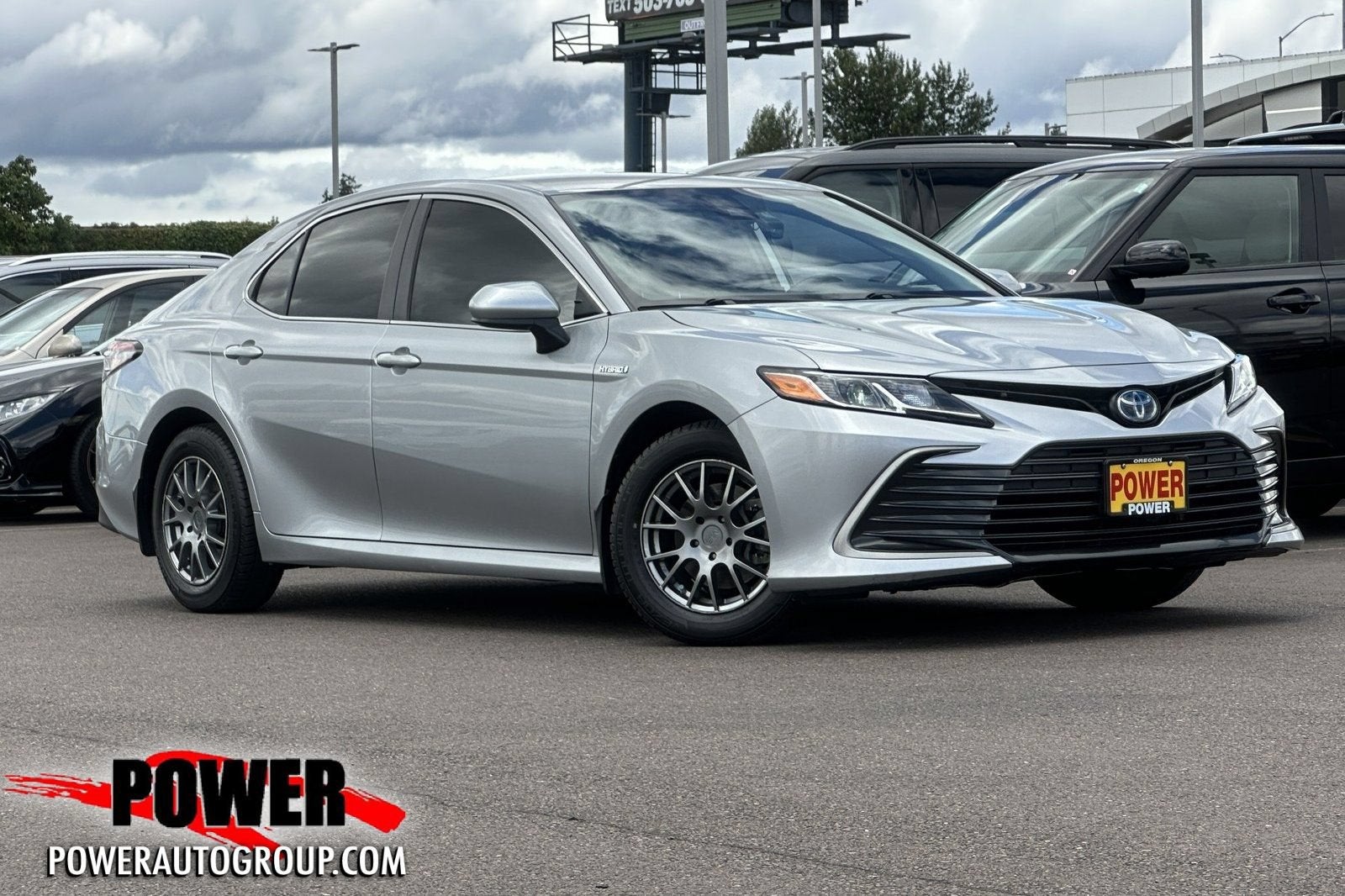 2021 Toyota Camry Hybrid LE in Celestial Silver — front three-quarter view