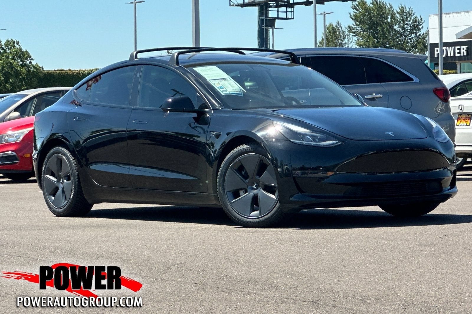 2021 Tesla Model 3 Standard Range Plus in Black — front three-quarter view