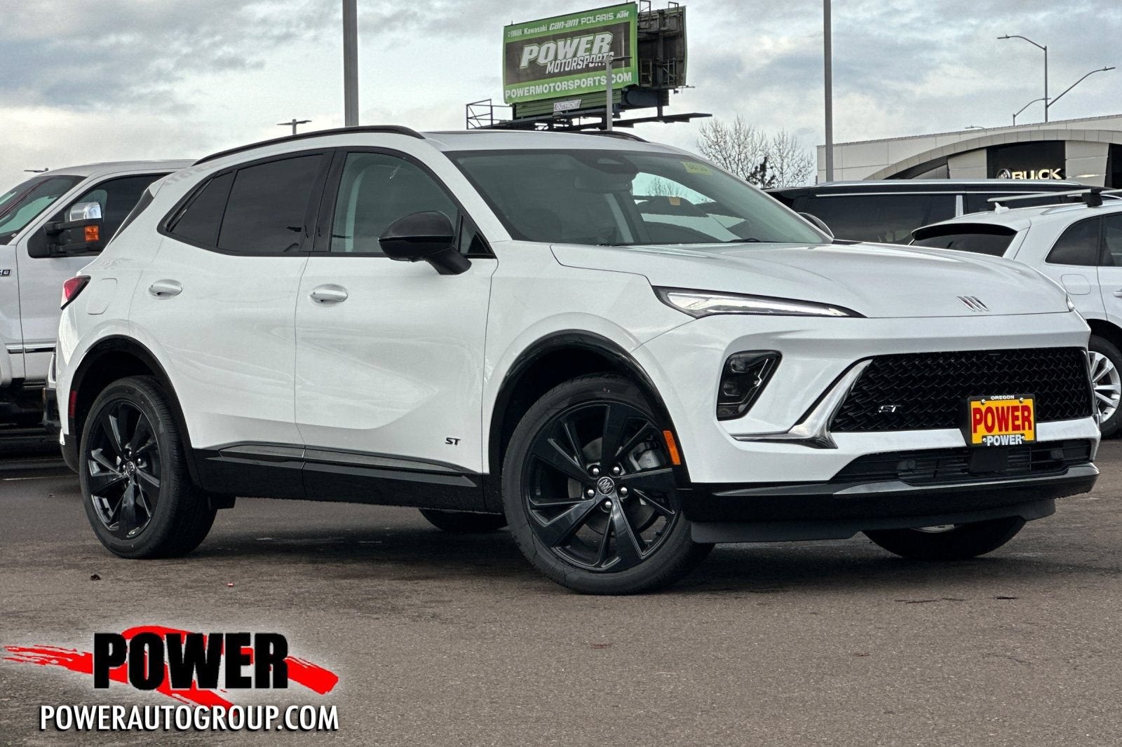 2026 Buick Envision Sport Touring in Summit White — front three-quarter view