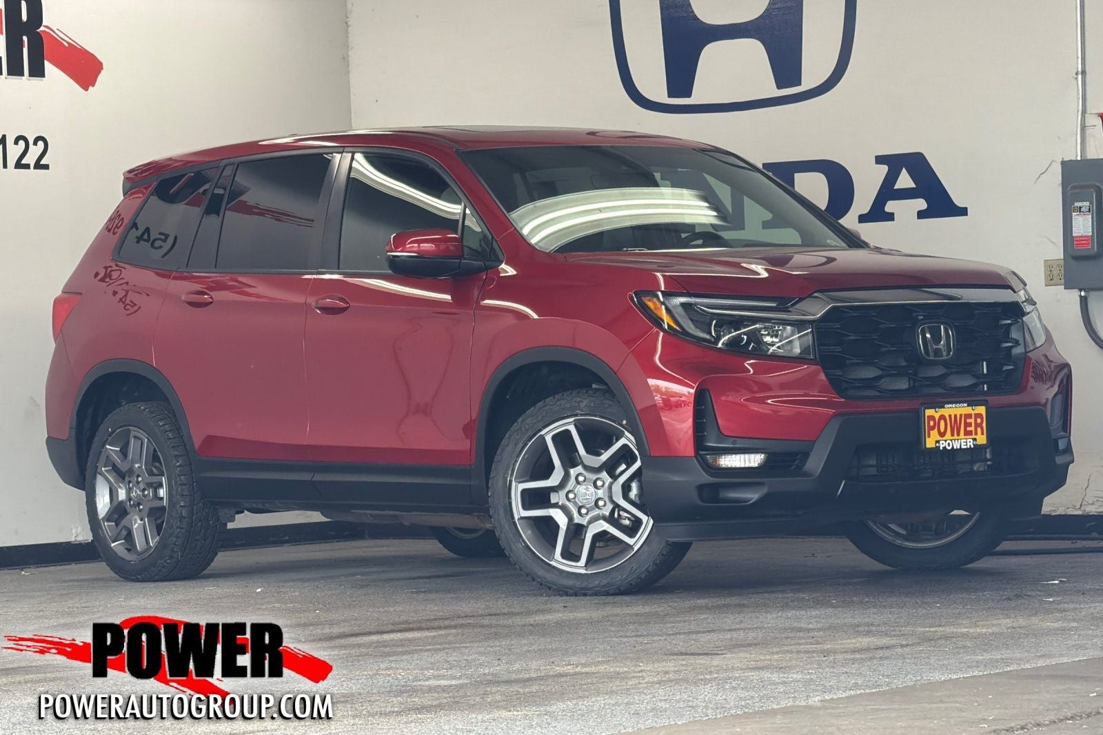 2023 Honda Passport EX-L in Red — front three-quarter view