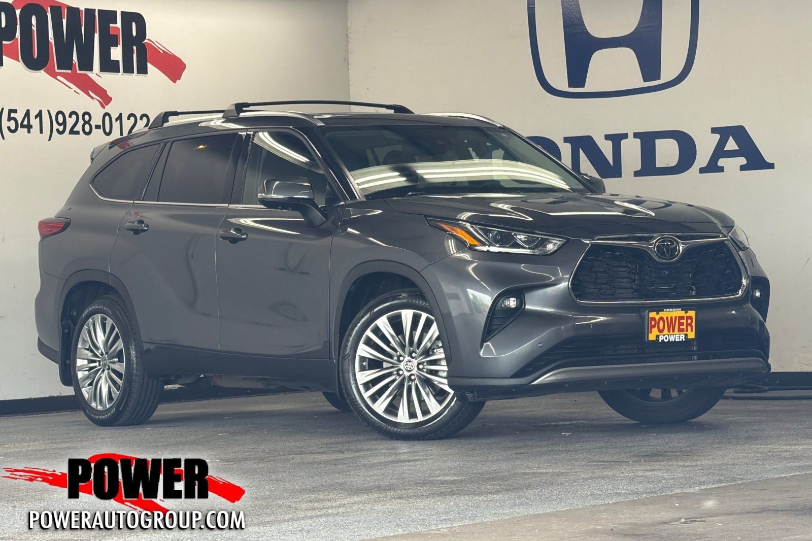 2023 Toyota Highlander Platinum in Magnetic Gray Metallic — front three-quarter view