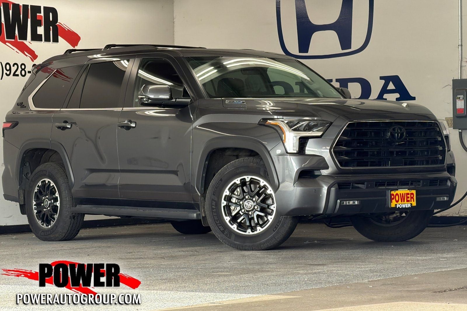 2024 Toyota Sequoia SR5 in Magnetic Gray Metallic — front three-quarter view