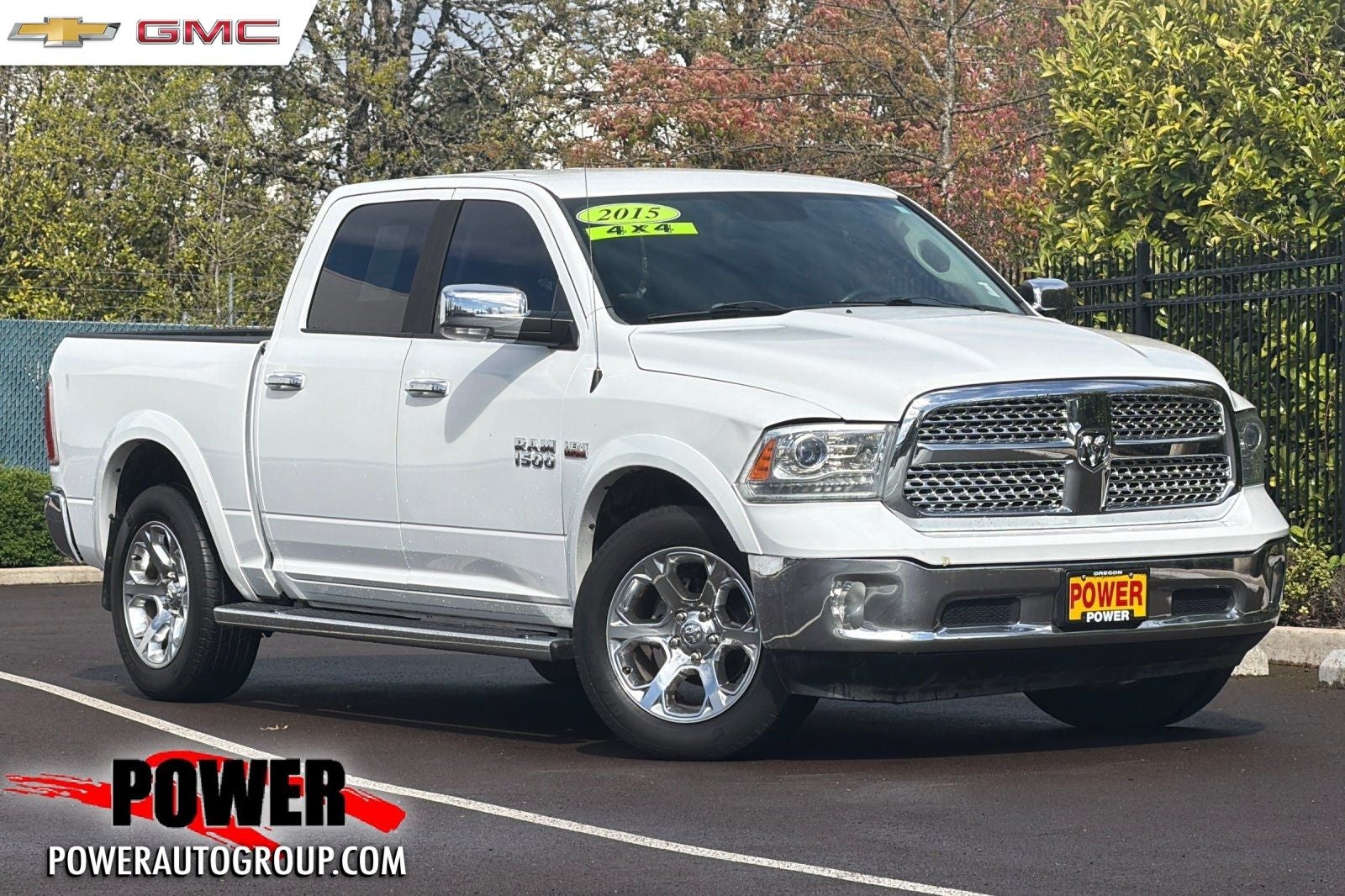 2015 RAM 1500 Laramie in Bright White Clearcoat — front three-quarter view