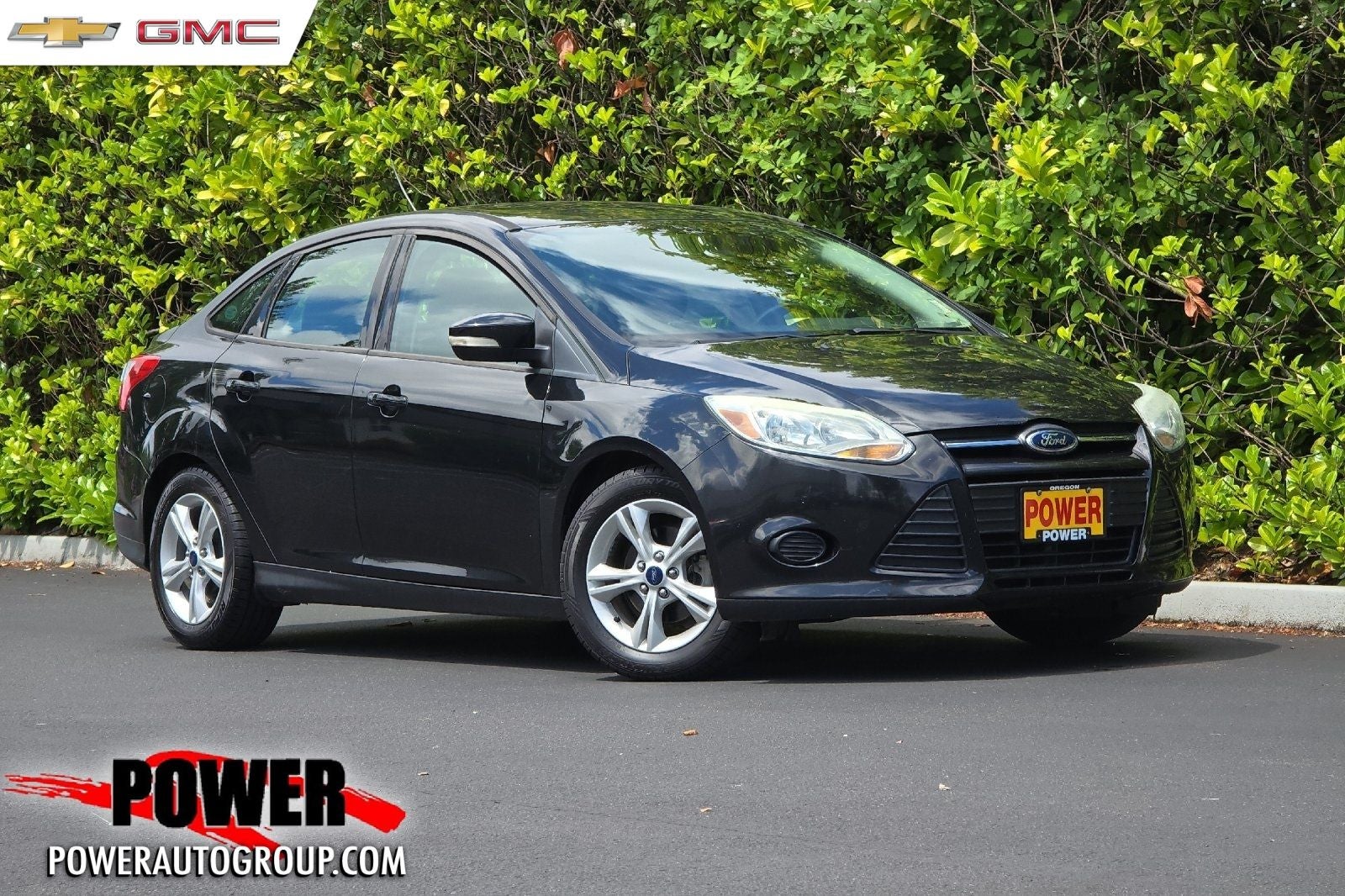 2014 Ford Focus SE in Tuxedo Black Metallic — front three-quarter view