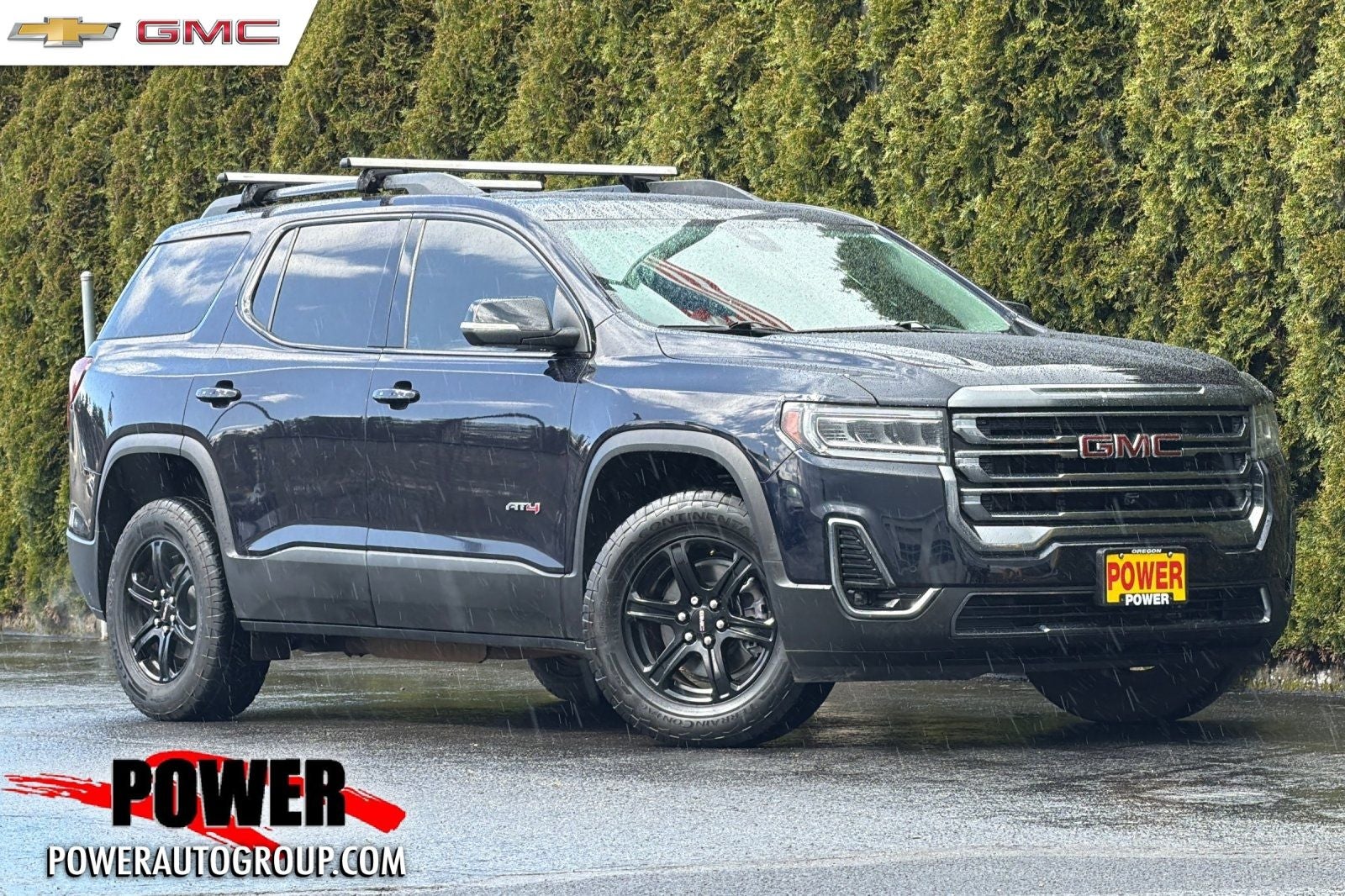 2022 GMC Acadia AT4 in Midnight Blue Metallic — front three-quarter view