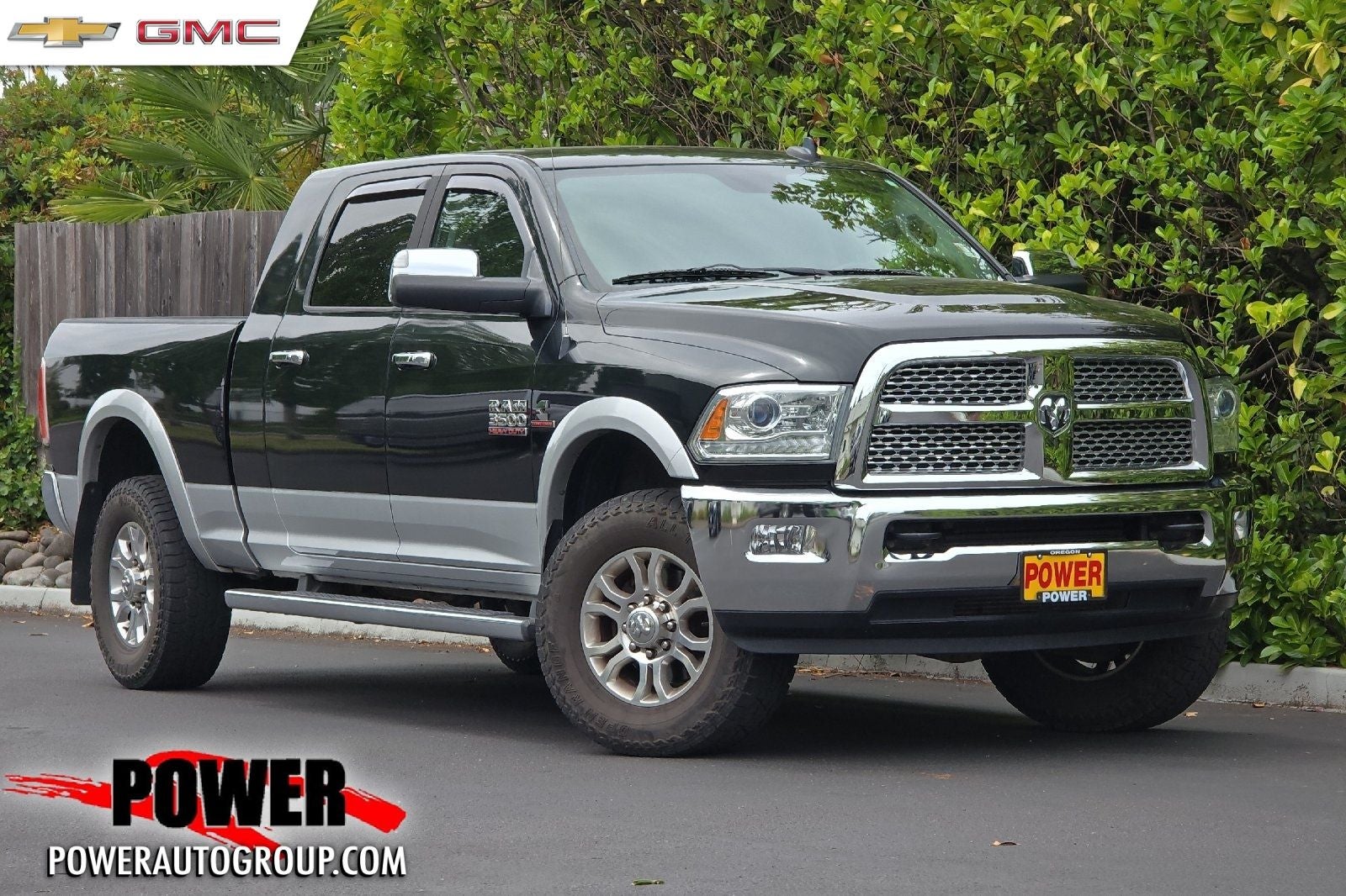 2015 RAM 3500 Laramie in Black / Forest Green — front three-quarter view