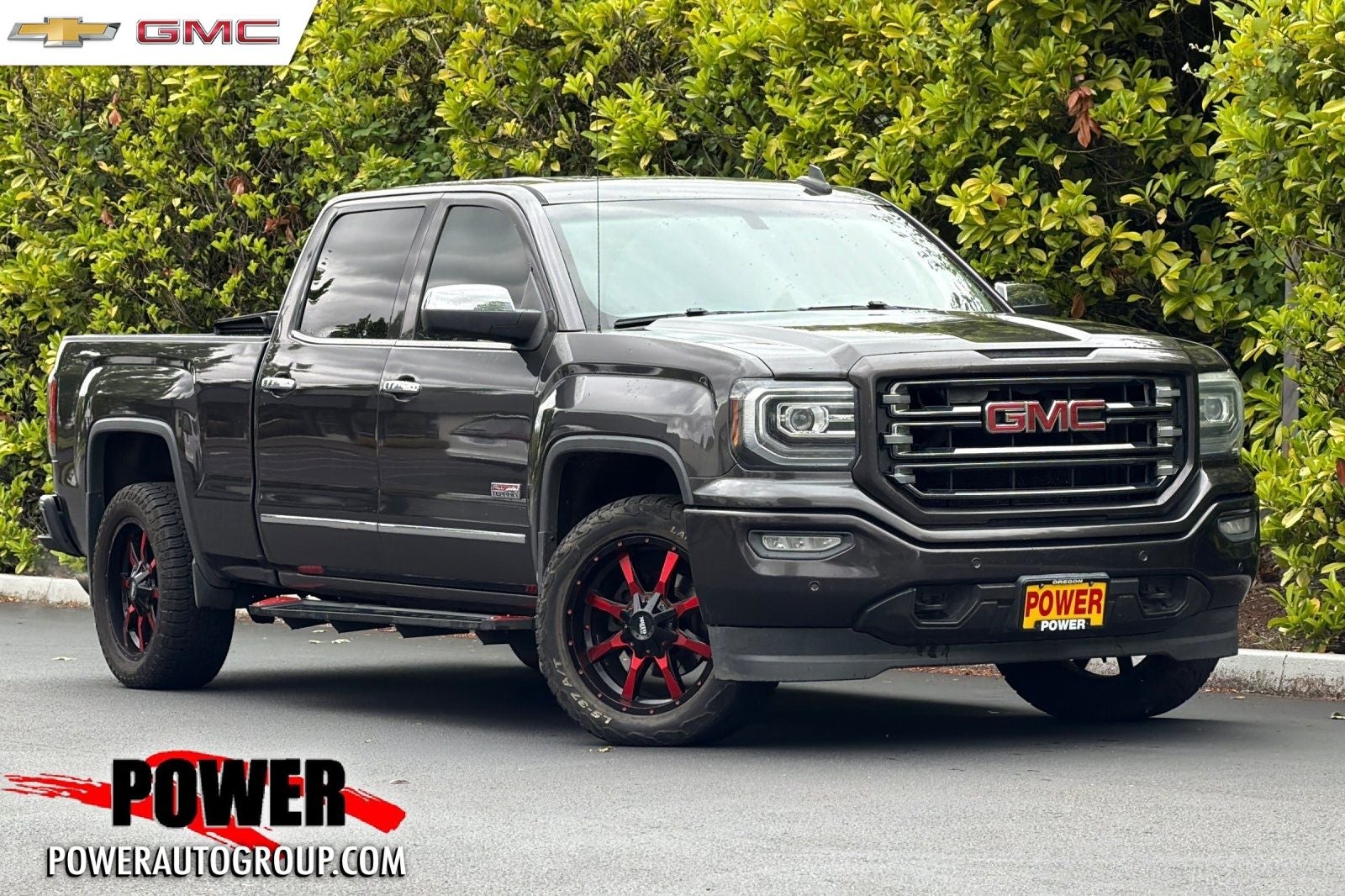 2016 GMC Sierra 1500 SLT in Iridium Metallic — front three-quarter view