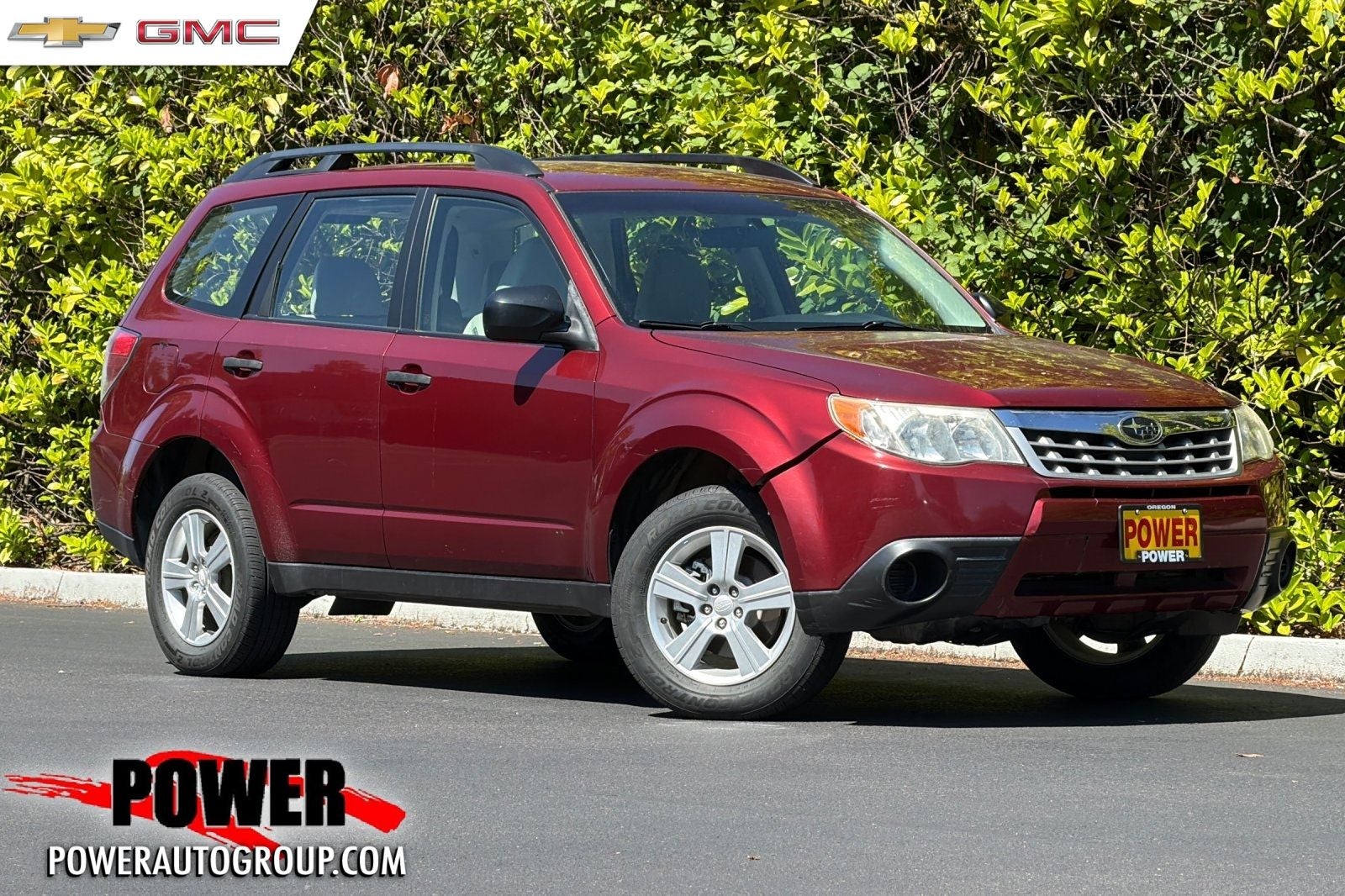 2012 Subaru Forester 2.5X in Camellia Red — front three-quarter view