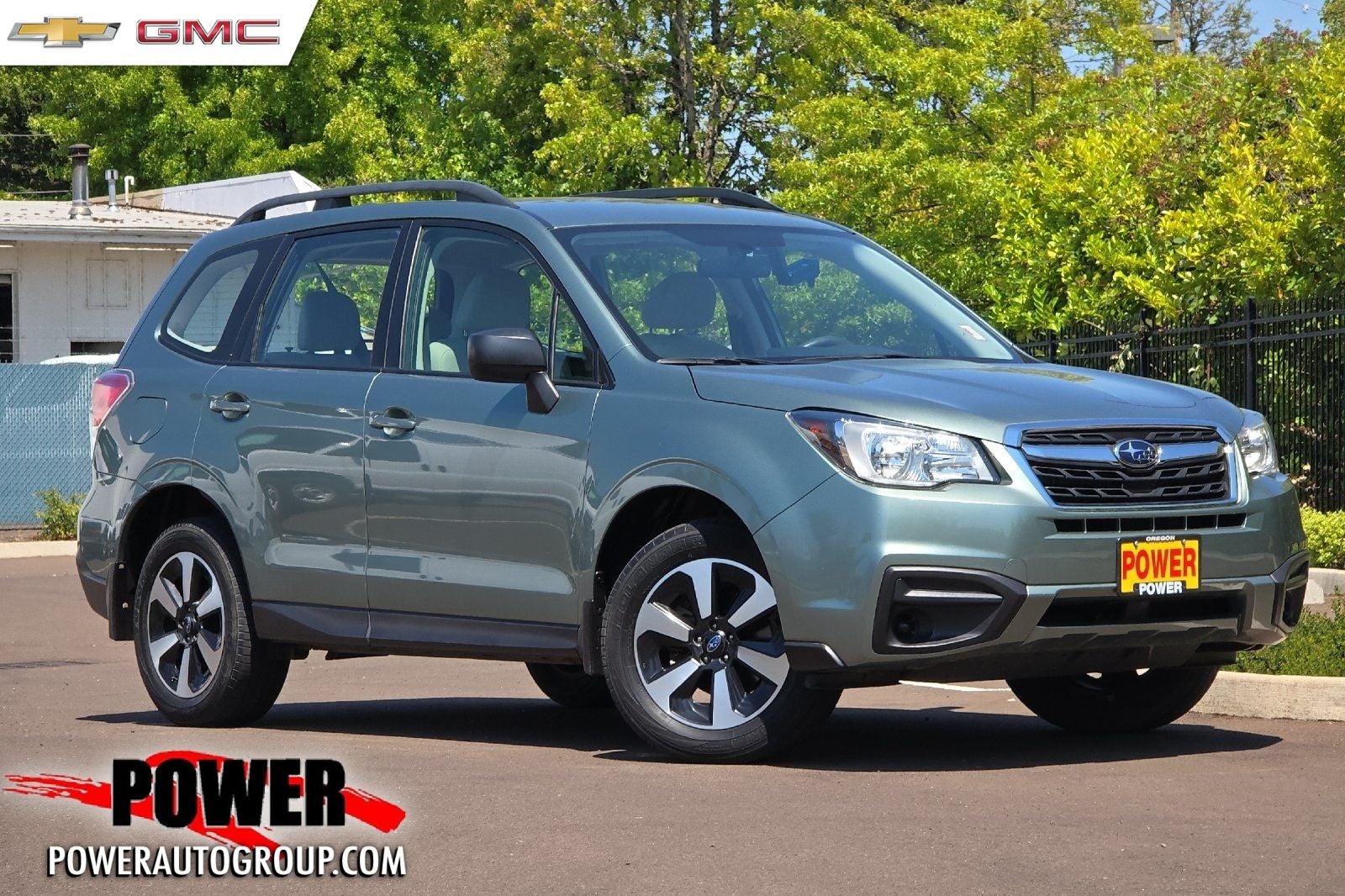 2018 Subaru Forester 2.5i in Green Metallic — front three-quarter view