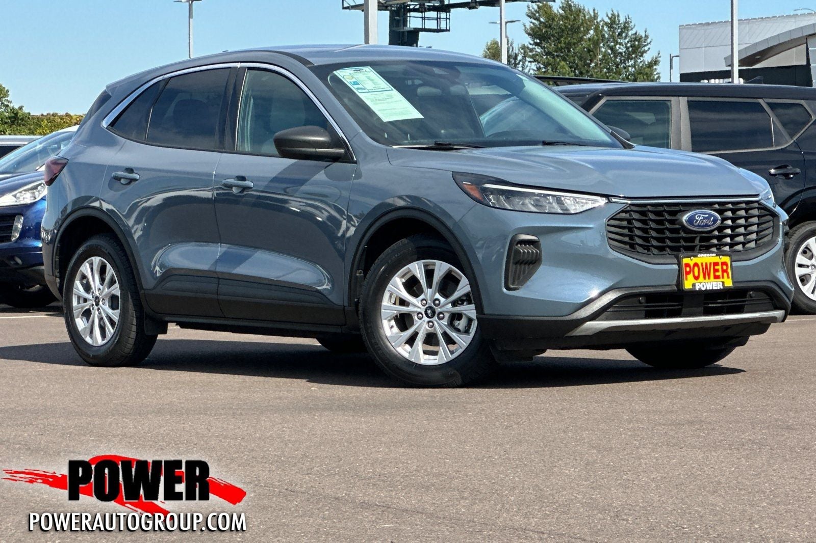 2023 Ford Escape Hybrid Active in Atlas Blue Metallic — front three-quarter view