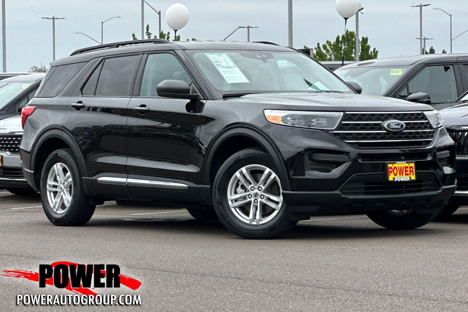 2023 Ford Explorer XLT in Black — front three-quarter view