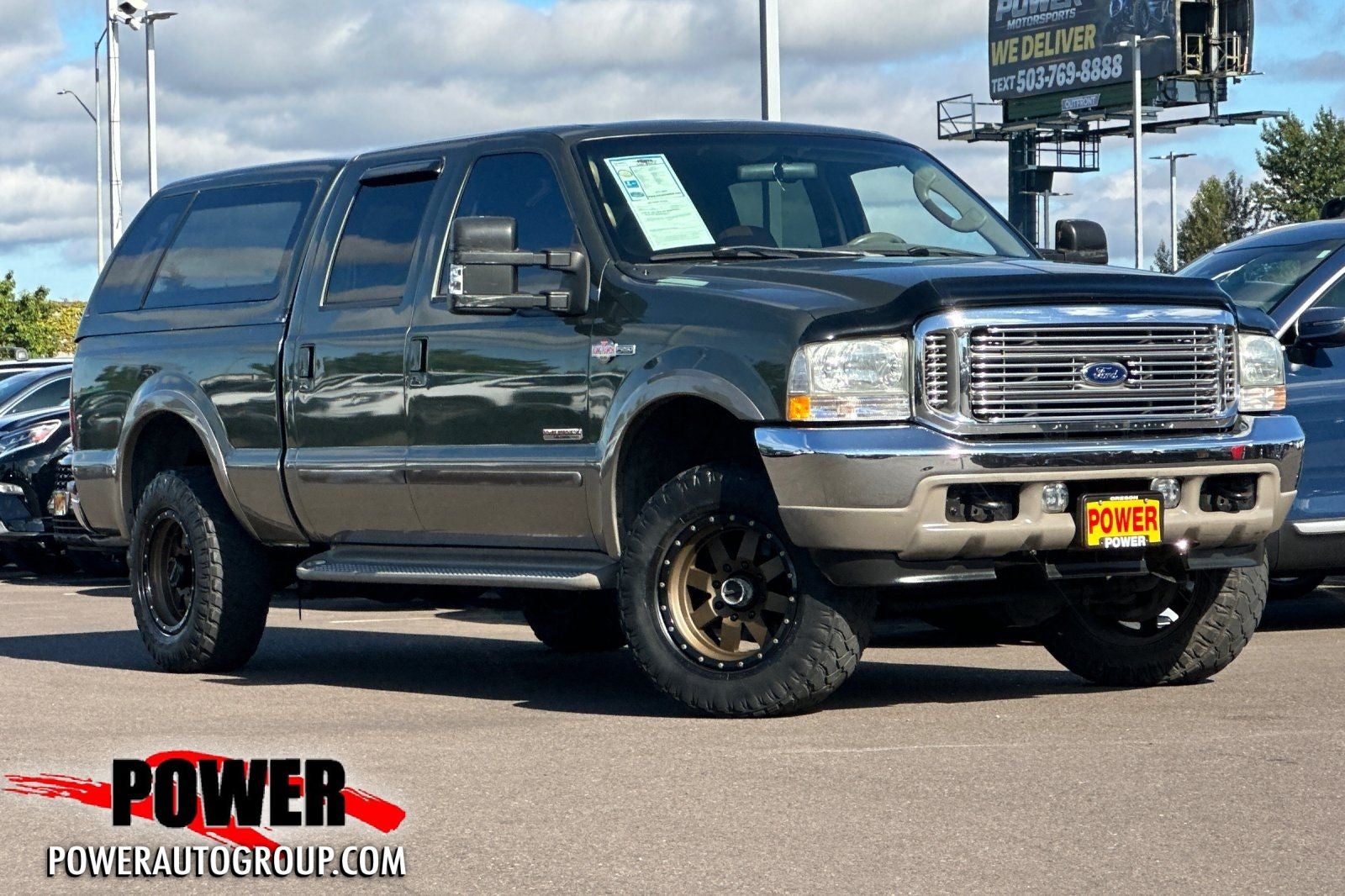2003 Ford F-250SD King Ranch in Dark Highland Green Clearcoat Metallic — front three-quarter view