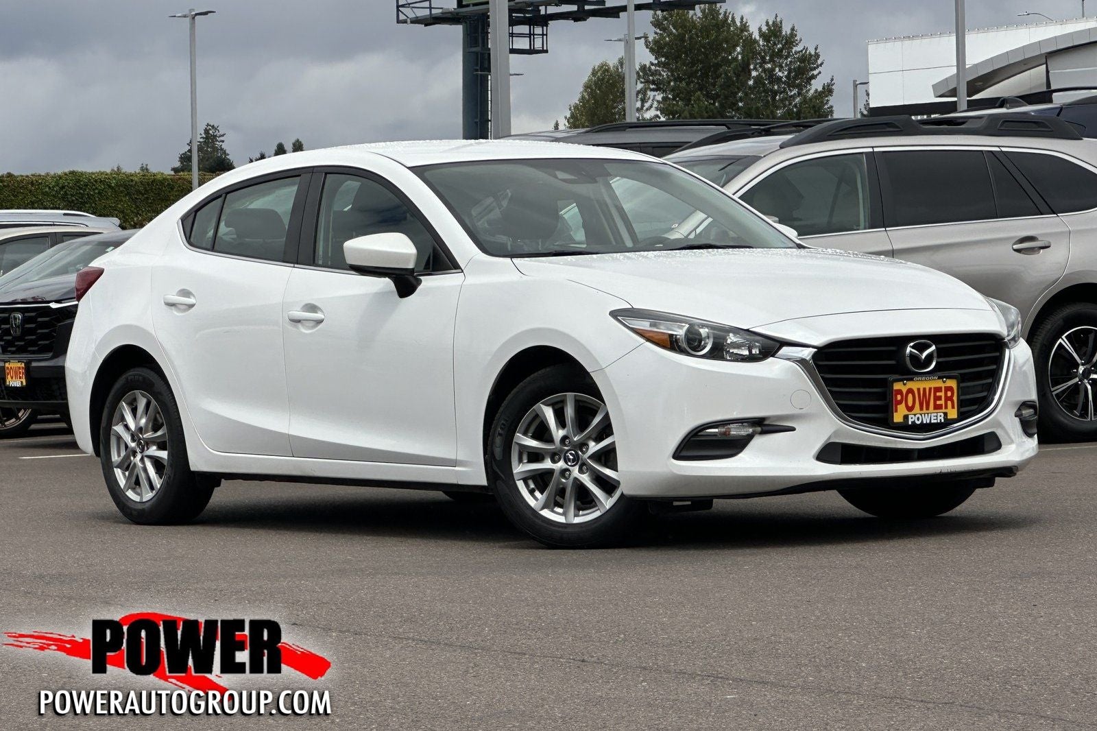2018 Mazda Mazda3 Sport in Snowflake White Pearl Mica — front three-quarter view