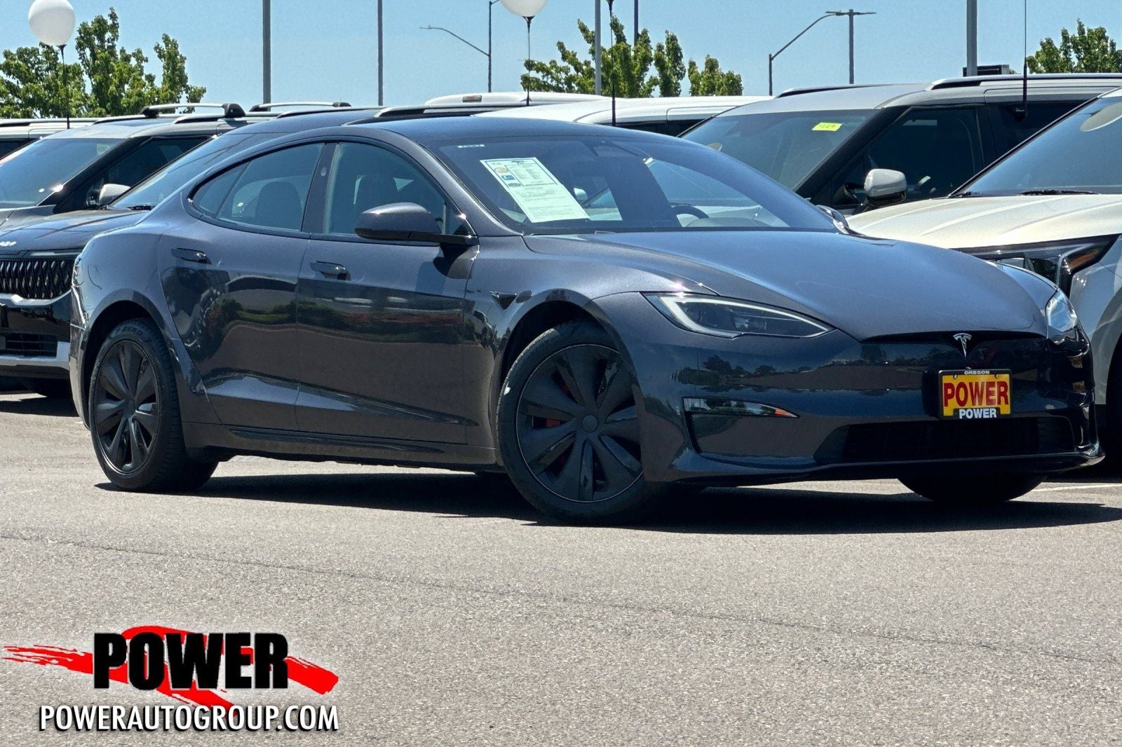 2025 Tesla Model S Plaid in Black — front three-quarter view