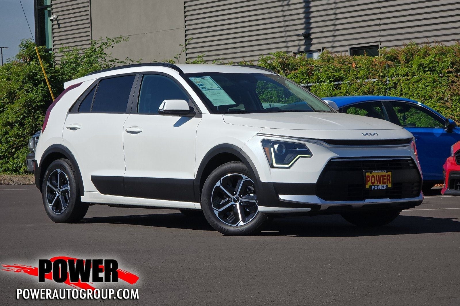 2023 Kia Niro Plug-In Hybrid EX in Snow White Pearl — front three-quarter view