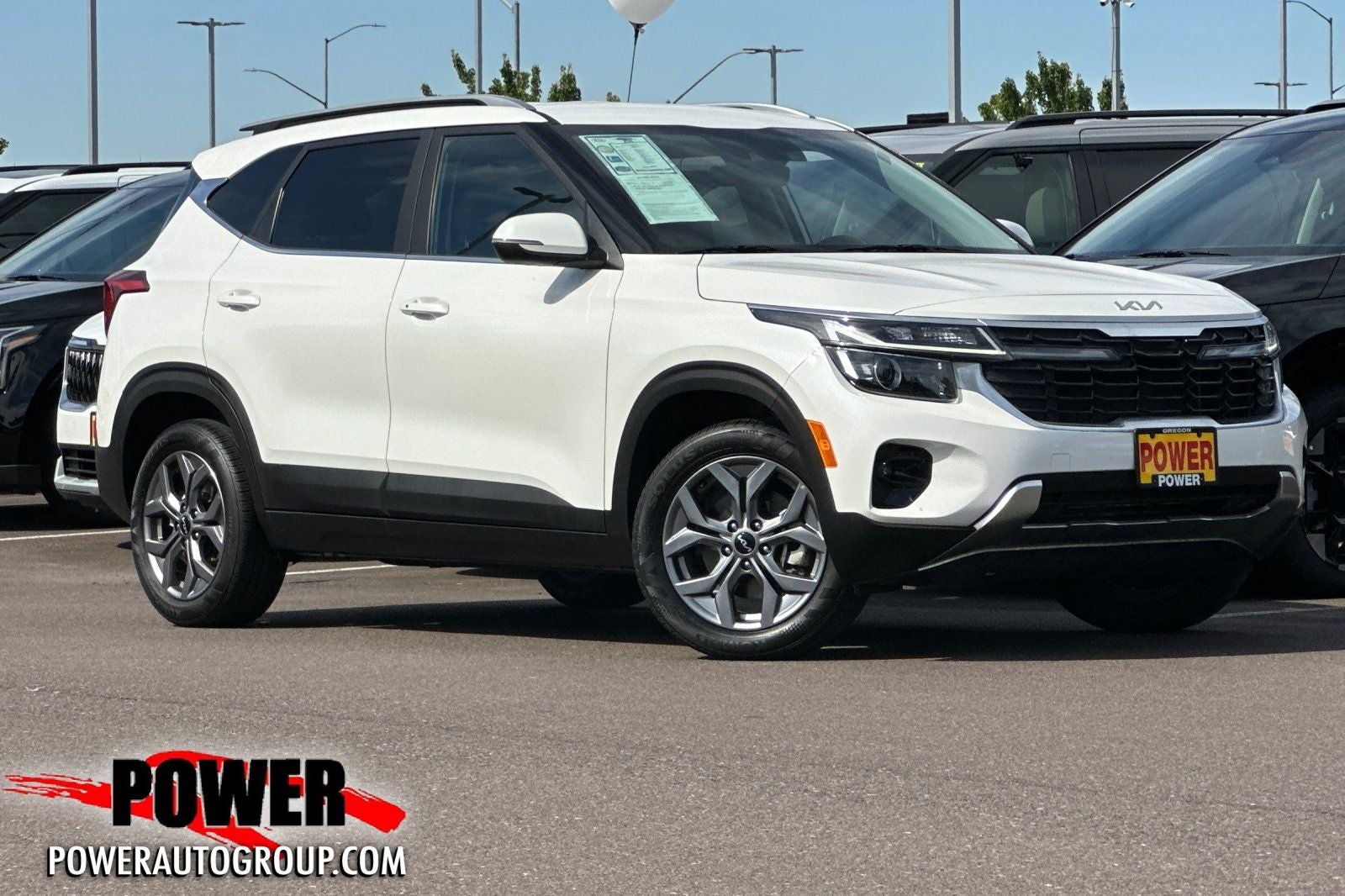 2024 Kia Seltos S in Snow White Pearl — front three-quarter view